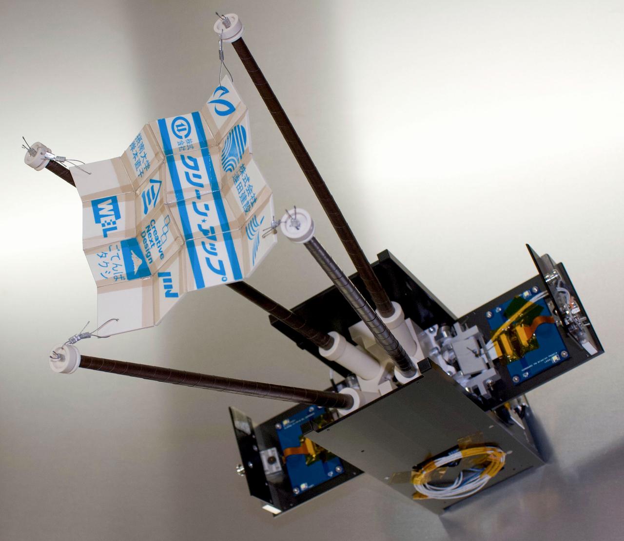 jsc2020e049617 (6/20/2020) --- A preflight view of the OPUSAT-II flight unit. The Osaka Prefecture University Satellite-II (OPUSAT-II) has two main missions, the transmission of High-speed data in an amateur radio band and the deployment of a two-dimensional deployable plate for high communications efficiency and high storage performance to demonstrate for use in the next generation of satellites. Image Credit:Takehiro Aoshima