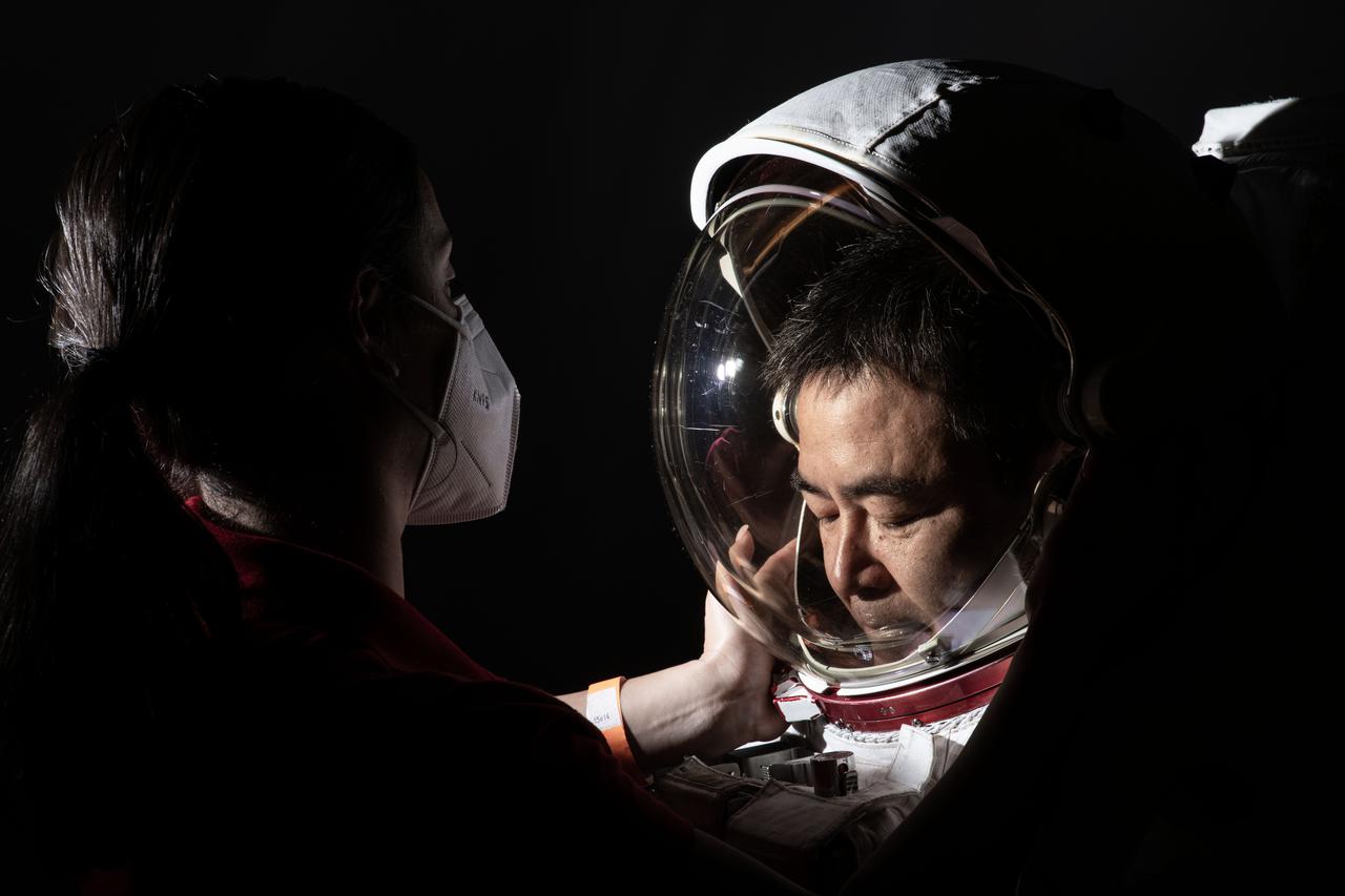 JAXA Astronaut Aki Hoshide get’s suited up for his EMU space suit portrait session. Hoshide is part of the Expedition 64/65 Mission crew and commander of the ISS for Expedition 65. He flew to station as part of Crew-2 aboard the Space-X Crew Dragon vehicle.