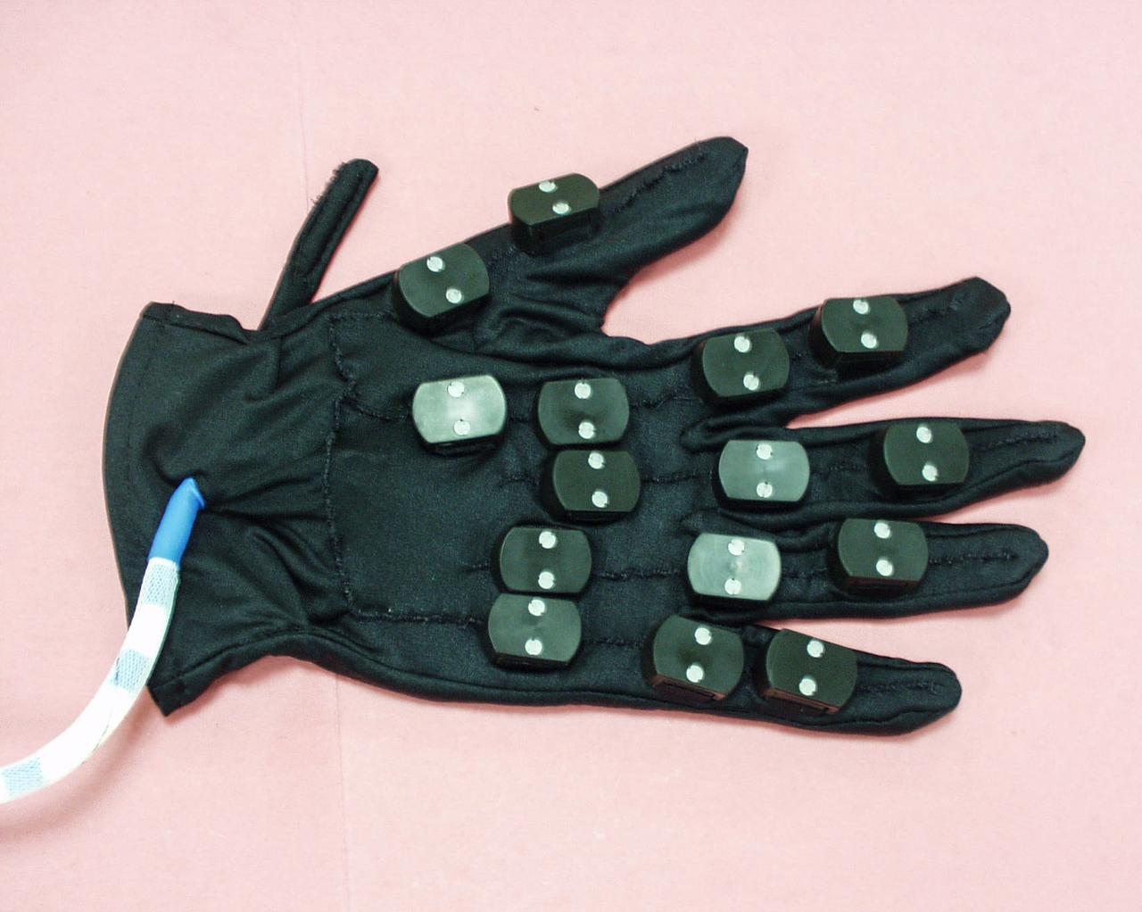 jsc2021e009416 (7/15/2002) --- A preflight view of the Hand Posture Analyzer (HPA) Posture Acquisition Glove (PAG). The Hand Posture Analyzer (HPA) facility helps to examine the way hand and arm muscles are used differently aboard the International Space Station (ISS). Image courtesy of the Italian Space Agency (ASI).