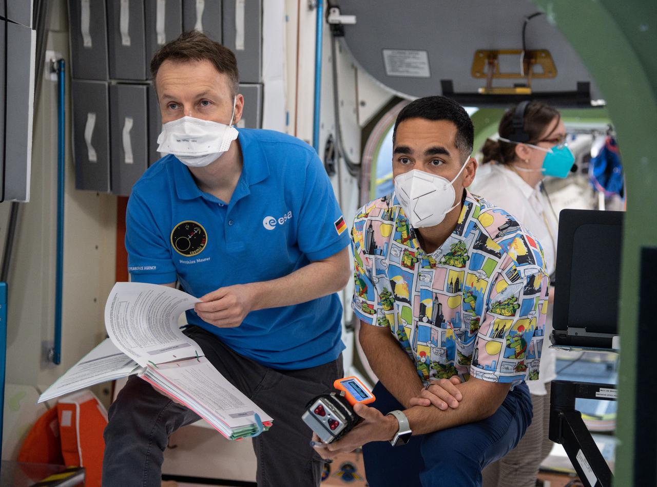 jsc2021e009539 (March 3, 2021) --- SpaceX Crew-3 astronauts (from left) Matthias Maurer and Raja Chari are pictured during a training session at the Space Vehicle Mockup Facility at NASA's Johnson Space Center in Houston, Texas.