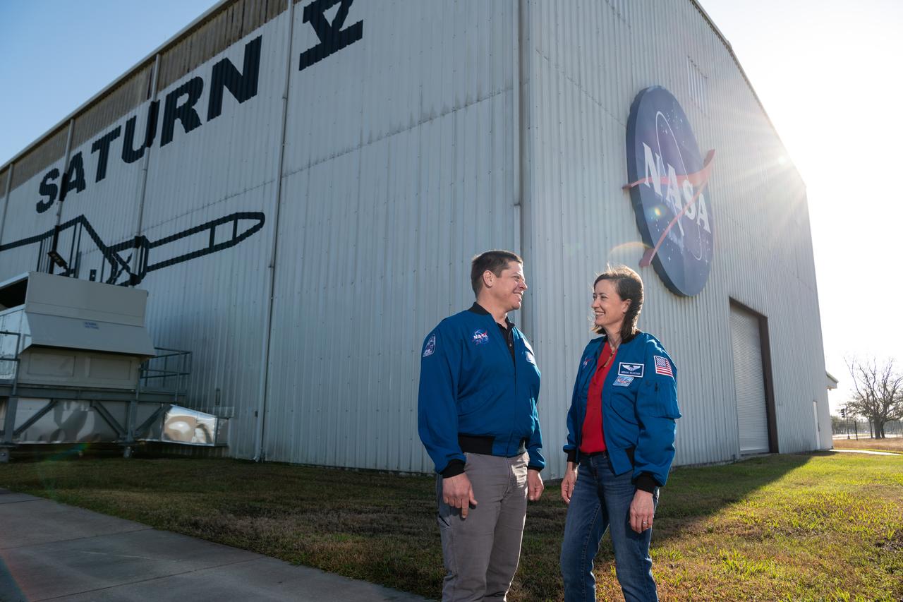 NASA Astronaut Bob Behnken with wife and fellow NASA Astronaut Megan McArthur outside the Saturn V Rocket facility at Johnson Space Center. They both flew to the International Space Station in the SpaceX Crew Dragon capsule. Behnken launched on Demo-2 in May 2020 and McArthur on Crew-2 in April 2021. Photographer: Norah Moran – Johnson Space Center