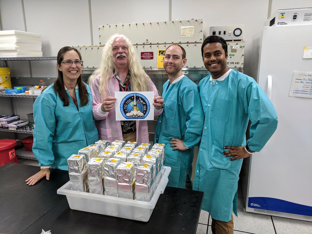 jsc2021e010331 (5/1/2019) --- The Gilroy Lab TICTOC team at their KSC lab: Sarah Swanson, Simon Gilroy, Richard Barker and Arkadipta Bakshi. Targeting Improved Cotton Through Orbital Cultivation (TICTOC) investigates the morphological and molecular adaptations of cotton seedlings to the microgravity environment encountered in the International Space Station (ISS). Image courtesy of Deb Wells