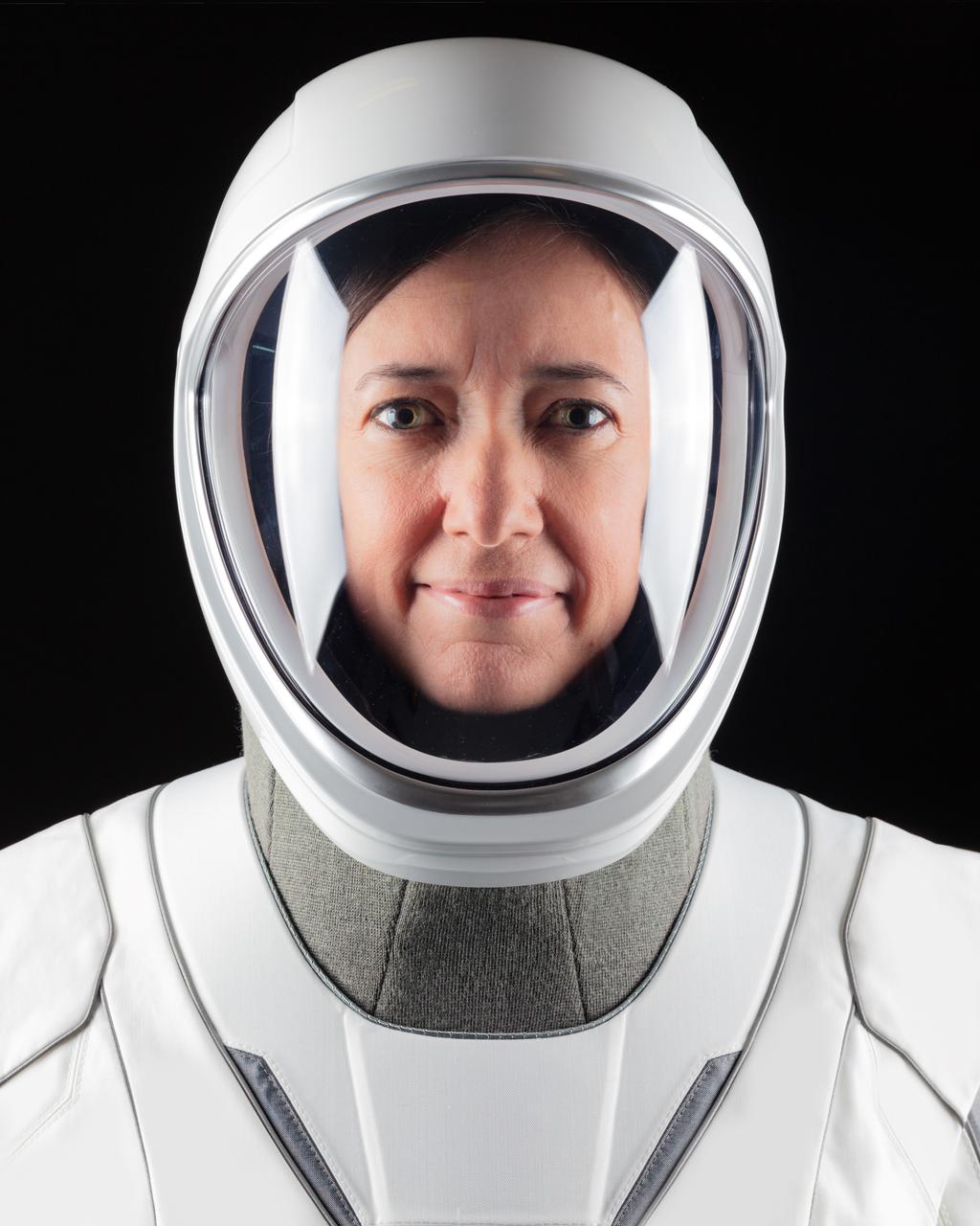 jsc2021e010823 (March 24, 2021) --- Astronaut Megan McArthur of NASA, SpaceX Crew-2 Pilot, poses for a portrait in her pressure suit at SpaceX headquarters in Hawthorne, California. Credit: SpaceX