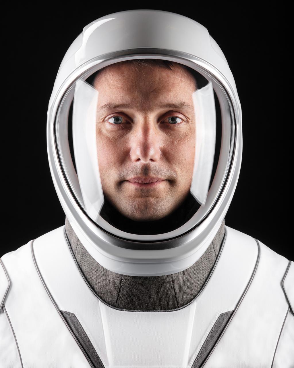 jsc2021e010826 (March 24, 2021) --- Astronaut Thomas Pesquet of ESA (European Space Agency), SpaceX Crew-2 Mission Specialist, poses for a portrait in his pressure suit at SpaceX headquarters in Hawthorne, California. Credit: SpaceX