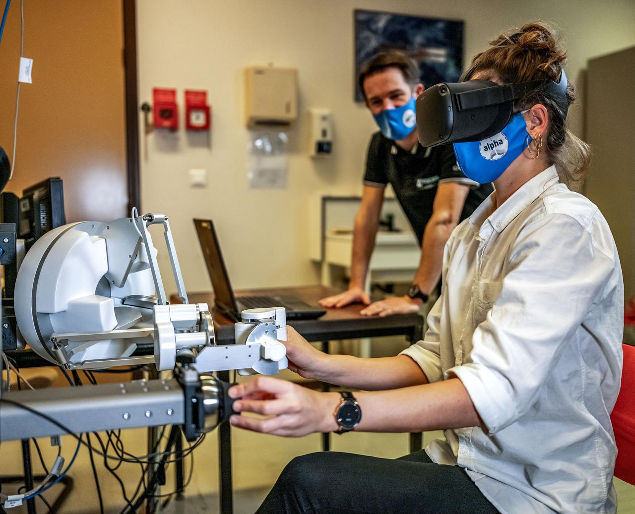 jsc2021e019398 (12/9/2020) --- Simulation of the Pilote experiment. In order to test the ergonomics of a multisensory interface for controlling robotic arms and spacecraft, it is necessary to perform the trials in microgravity. Performing the test on Earth would lead to a design of a work station using terrestrial ergonomic principles that do not correspond to conditions experienced on a spacecraft in orbit. The Pilote investigation tests the effectiveness of novel control schemes for the remote operation of robotic arms and space vehicles, using virtual reality and a new class of user-machine interfaces based on haptics. Image courtesy of CNES/DE PRADA Thierry.