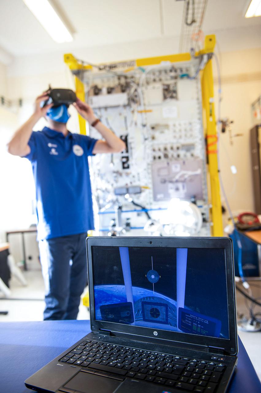 jsc2021e019400 (1/12/2021) --- Simulation of the Pilote experiment. In order to test the ergonomics of a multisensory interface for controlling robotic arms and spacecraft, it is necessary to perform the trials in microgravity. Performing the test on Earth would lead to a design of a work station using terrestrial ergonomic principles that do not correspond to conditions experienced on a spacecraft in orbit. The Pilote investigation tests the effectiveness of novel control schemes for the remote operation of robotic arms and space vehicles, using virtual reality and a new class of user-machine interfaces based on haptics. Image courtesy of CNES/GRIMAULT Emmanuel.