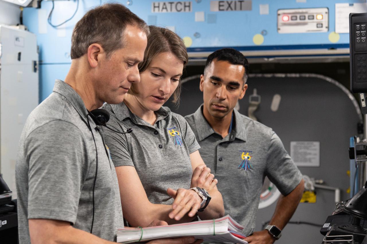 jsc2021e023379 (June 18, 2021) ---SpaceX Crew-3 astronauts (from left) Thomas Marshburn, Kayla Barron and Raja Chari train at the Space Vehicle Mockup Facility at NASA's Johnson Space Center in Houston, Texas.