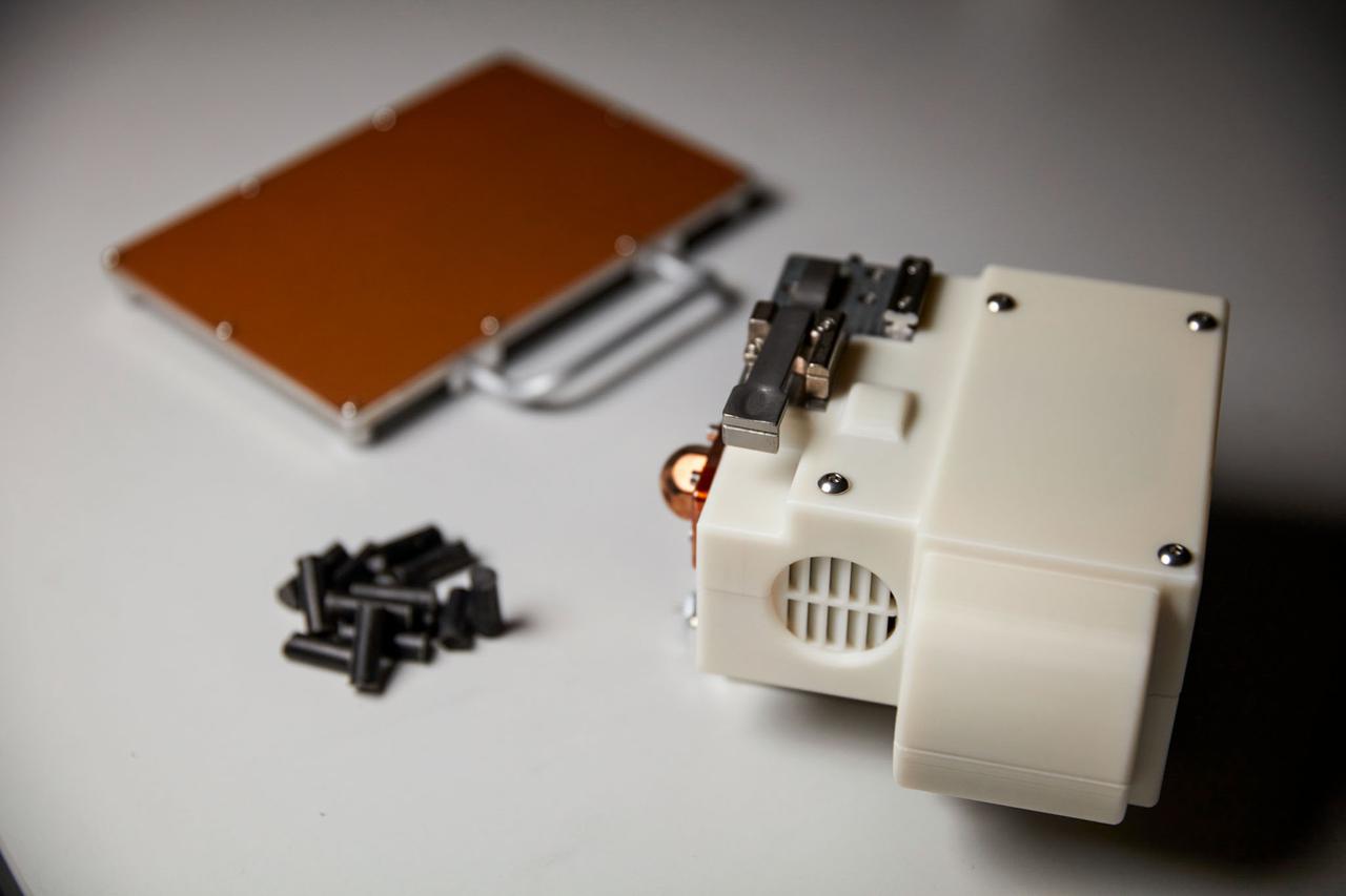 jsc2021e031161 (7/22/2021) --- A preflight view of the Redwire Regolith Print (RRP) facility suite launching aboard NG-16, including the RRP print heads, plates and lunar regolith simulant feedstock Photo courtesy of Redwire Space.