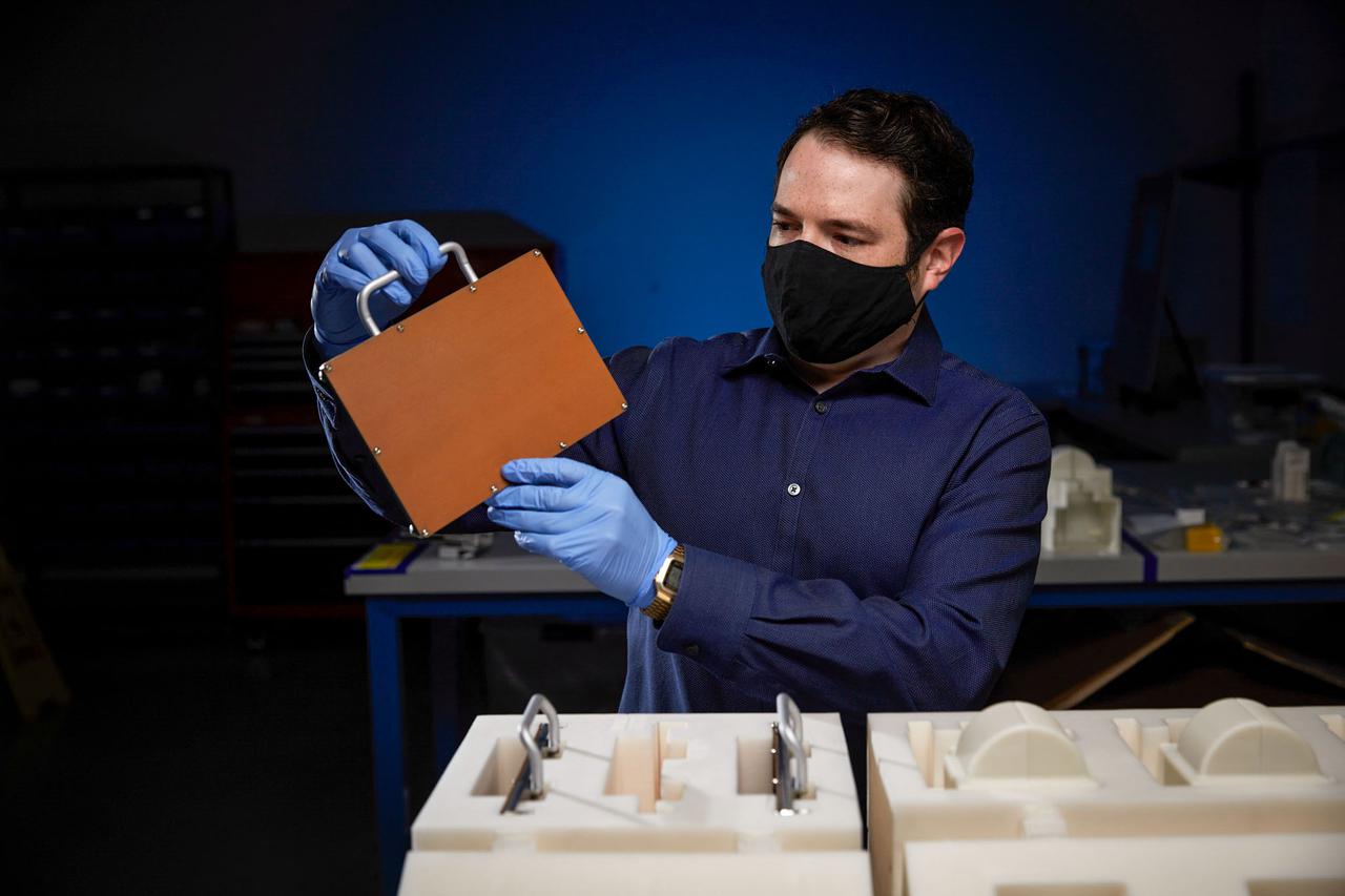 jsc2021e031162 (7/22/2021) --- Redwire’s Howie Schulman, project lead, packs the Redwire Regolith Print printing plate ahead of delivery to NASA for launch. Photo courtesy of Redwire Space.