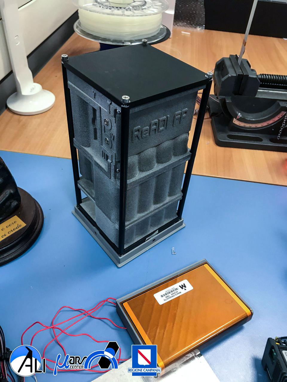 jsc2021e036648 (8/4/2021) --- A preflight image of the READI FP shell assembled before the immersion test. REducing Arthritis Dependent Inflammation First Phase (READI FP) evaluates how microgravity and space radiation affect the generation of bone tissue. It also examines the potential protective effects of bio-collagen and bioactive metabolites such as antioxidants during spaceflight. The source of these metabolites are vegetal extracts produced as waste products in wine production.