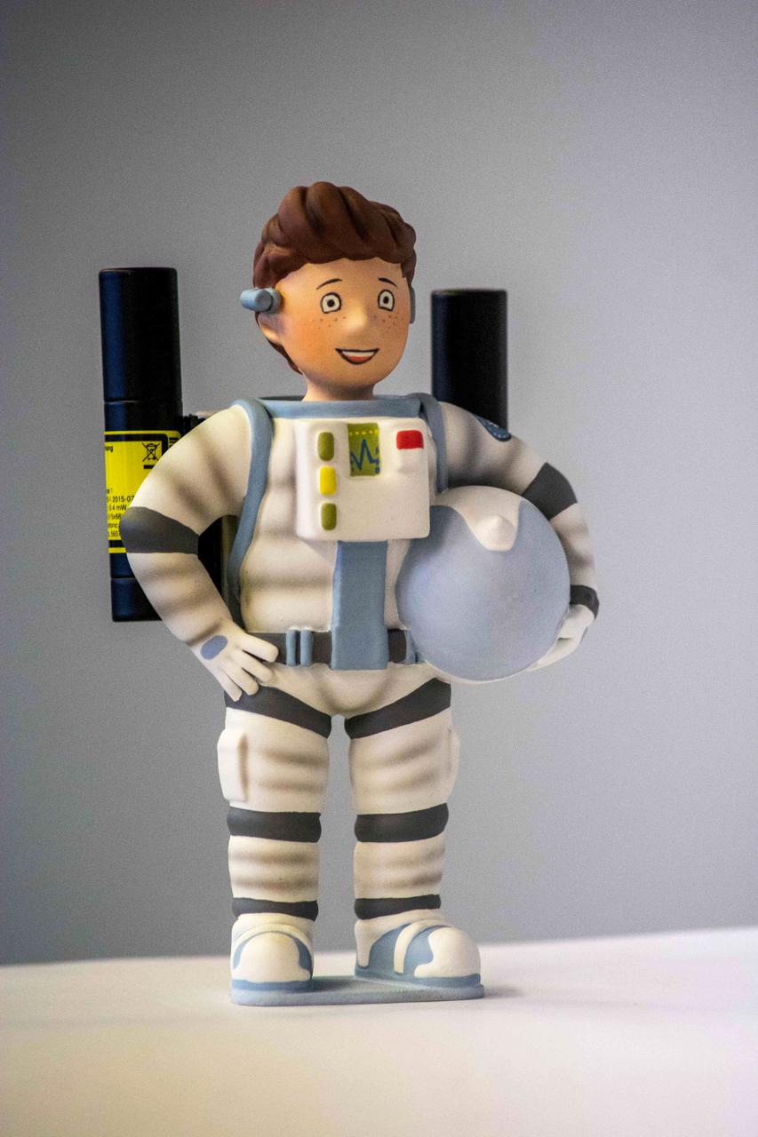 jsc2021e037888 (3/5/2021) --- A preflight photo of the Little Major Tom figure with two laser-pointers as the third object to be observed rotating around its intermediate axis for the Dzhanibekov Demonstrations investigation. Image courtesy of DLR.