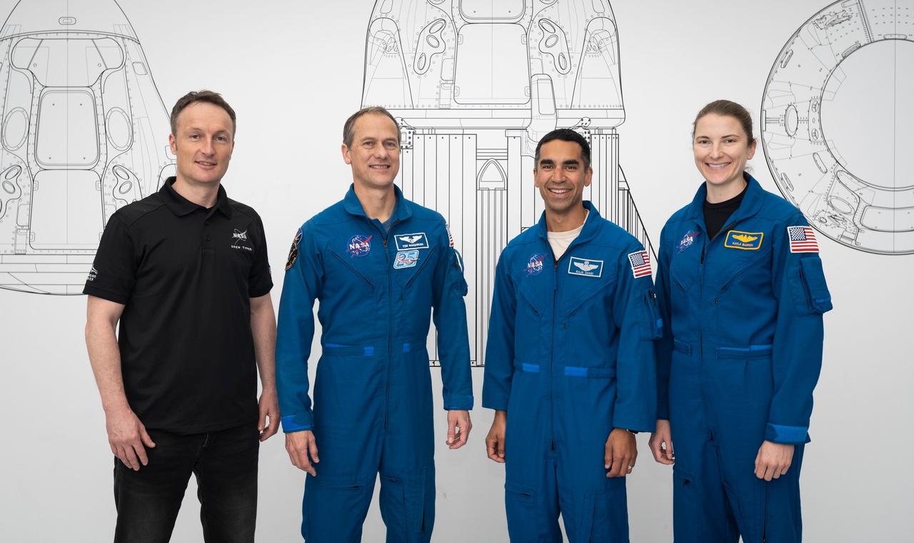 jsc2021e038353 (May 6, 2021) --- SpaceX Crew-3 astronauts (from left) Matthias Maurer, Thomas Marshburn, Raja Chari and Kayla Barron pose for a portrait during preflight training at SpaceX headquarters in Hawthorne, California. Credit: SpaceX