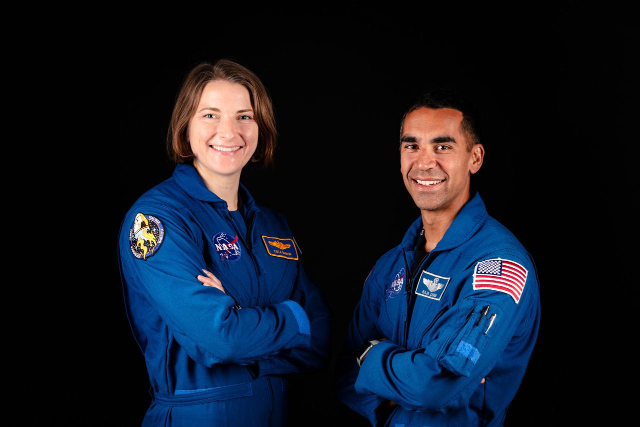 jsc2021e038366 (June 25, 2021) --- NASA astronauts and SpaceX Crew-3 crew members Kayla Barron and Raja Chari pose for a portrait at SpaceX headquarters in Hawthorne, California. Credit: SpaceX