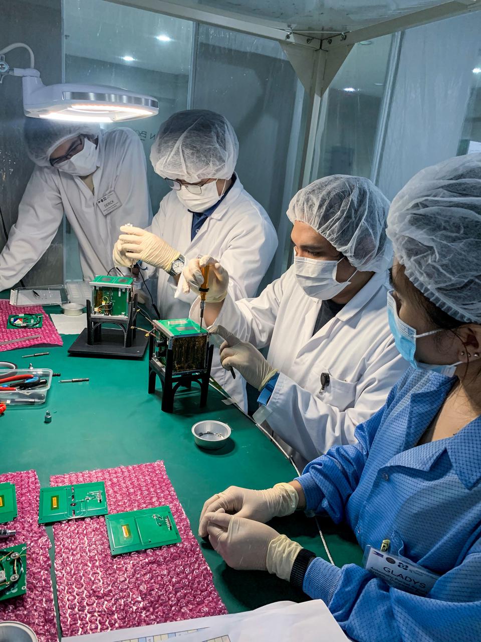 jsc2021e042552 (10/29/2020) --- Maya-3 and Maya-4 Flight Model Assembly inside the Clean Booth at the University Laboratory for Small Satellites and Space Engineering Systems (ULyS3Es), University of the Philippines-Diliman . The BIRDS-2S project consists of the Maya-3 and Maya-4 CubeSats, the first Philippine university-built cube satellites developed by eight graduate students under the Space science education and Technology Proliferation through University Partnerships (STeP-UP) Project.  Image Credit: Batch-1 STeP-UP Scholars