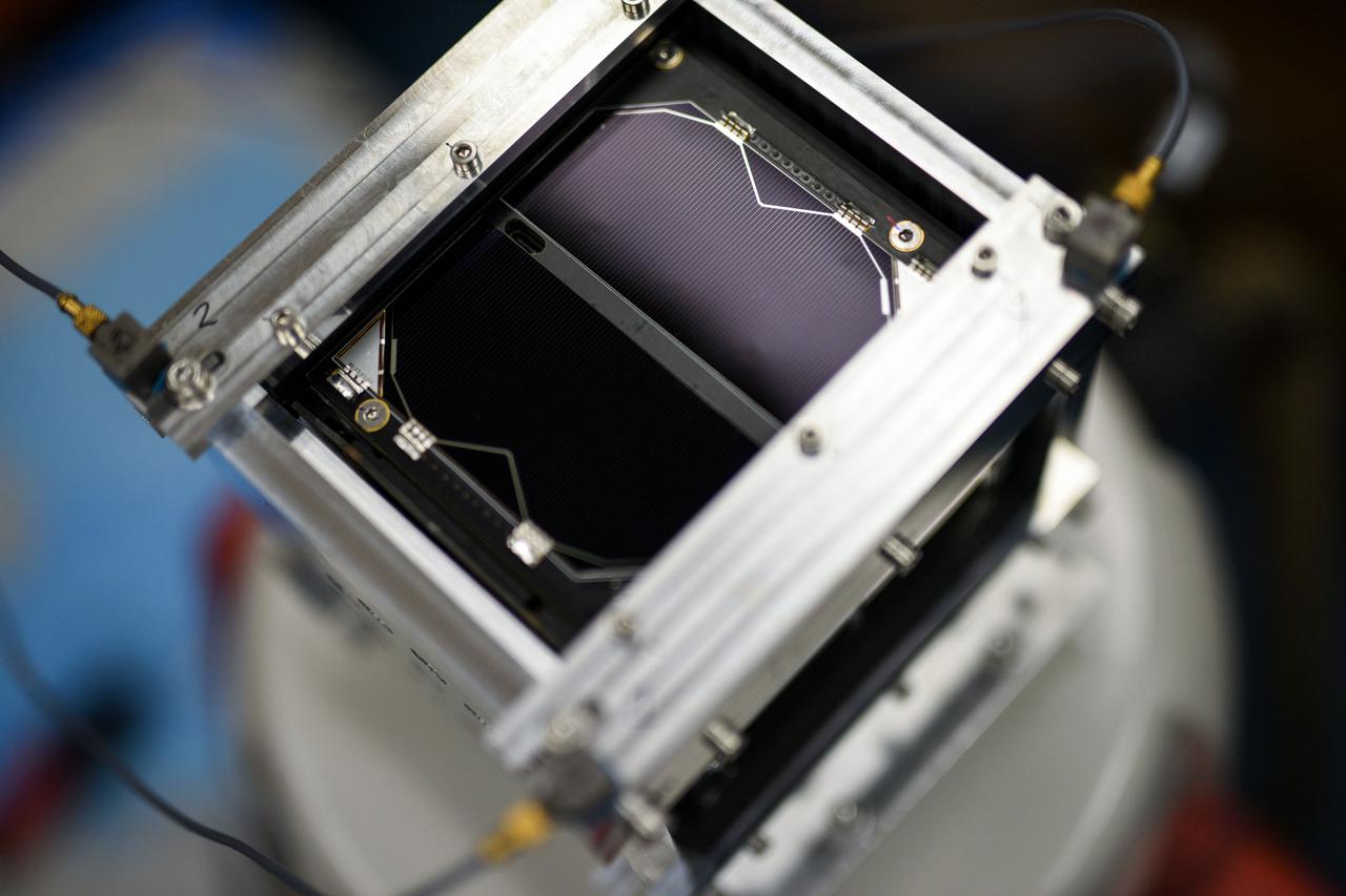 jsc2021e052202 (3/11/2021) --- A view of the Binar-1 flight model undergoing routine vibration testing for flight qualification. Secured firmly inside an aluminum casing, the vibration sensors seen on the corners of the frame monitor the response of the spacecraft to the simulated violent shaking expected to be experienced during launch. Binar-1 is a 1-Unit (1U) CubeSat, the first in a series from Curtin University in Perth, Australia, to help establish a capability for planetary research. The satellite is developed by a team of students and researchers with the intention to cultivate the skills and technology to build future planetary missions focused on the Moon and small bodies of the solar system. Image courtesy of Curtin University.