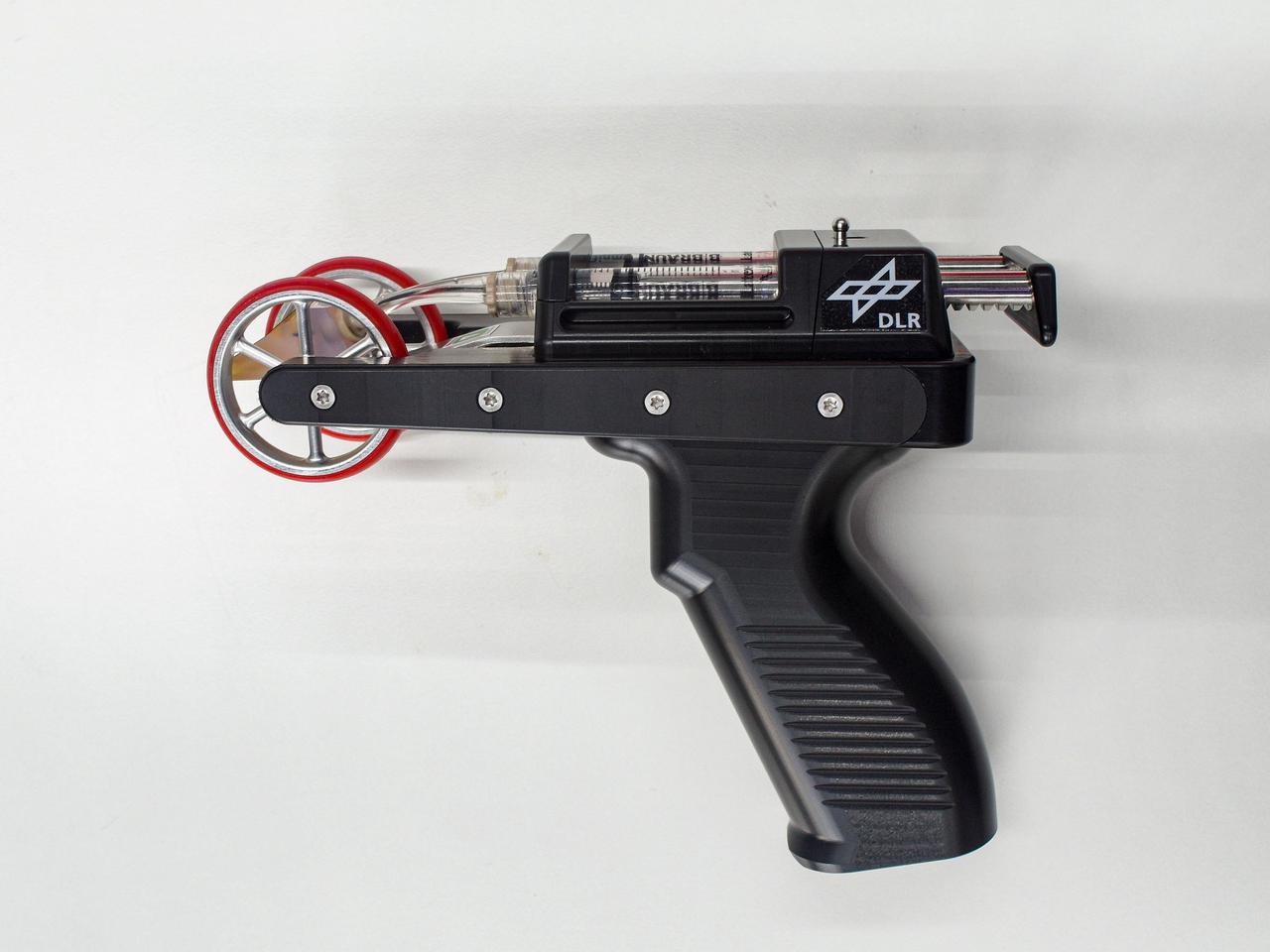 jsc2021e063287 (1/3/2021) --- Bioprinting, a subcategory of 3D printing, uses viable cells and biological molecules to print tissue structures. Bioprint FirstAid Handheld Bioprinter (Bioprint FirstAid), an investigation from European Space Agency (ESA), demonstrates a portable, handheld bioprinter that uses a patient’s own skin cells to create a tissue-forming patch to cover a wound and accelerate the healing process. Image courtesy of OHB/DLR/ESA.