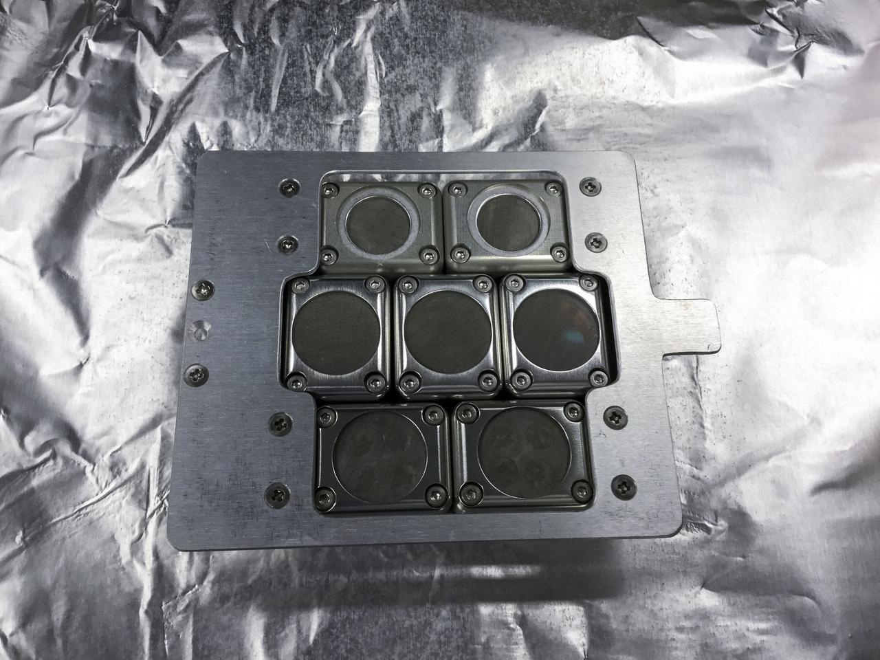 jsc2021e066967 (9/2/2021) --- A preflight view of the Tanpopo-4 hardware. Tanpopo is a Japanese astrobiological space exposure experiment on ISS. There are 7 small cells containing microorganisms, mosses and organic compounds to be determined their stabilitites and alterations (Tanpopo-4).