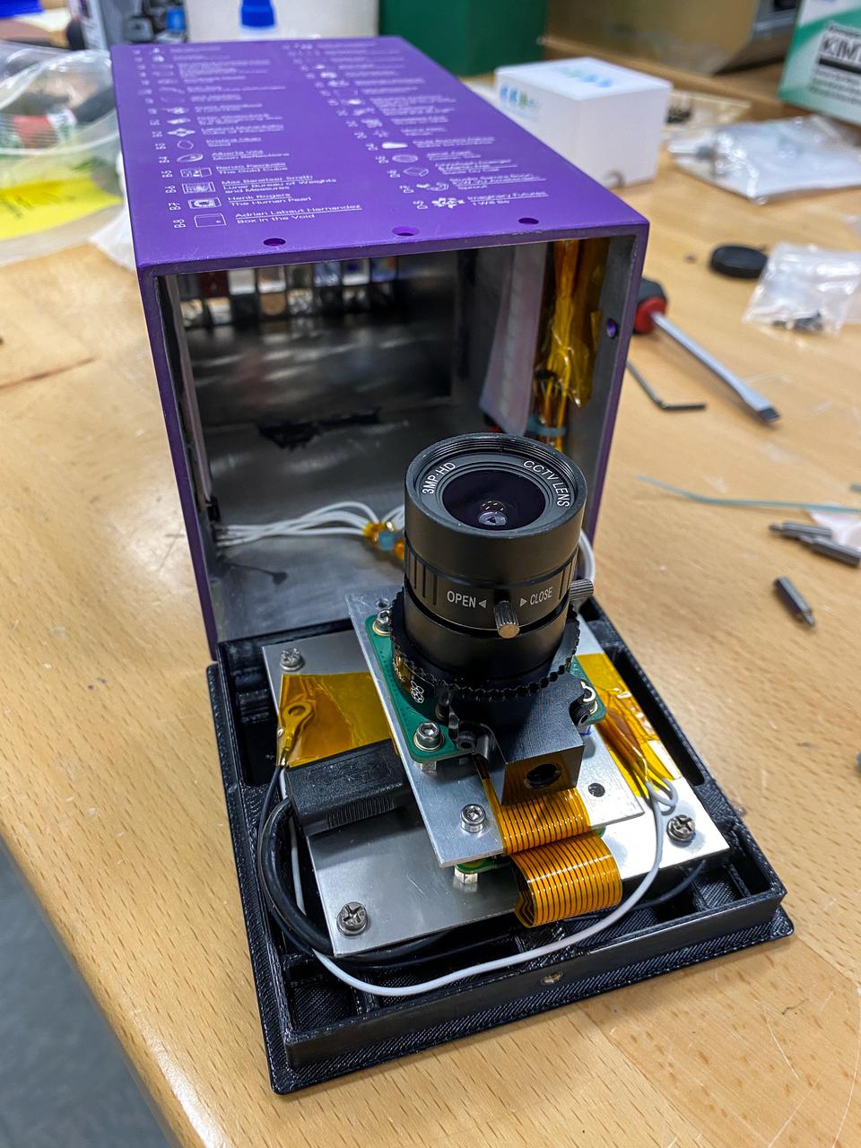 jsc2022e008878 (12/9/2021) --- A preflight view of the Moon Gallery payload. Moon Gallery evaluates the performance of a single-board computer platform with a high-quality camera in the space station’s radiation environment. Photos and videos taken with the camera become part of an art installation known as the Moon Gallery. The camera could be used in future space platforms and science hardware.