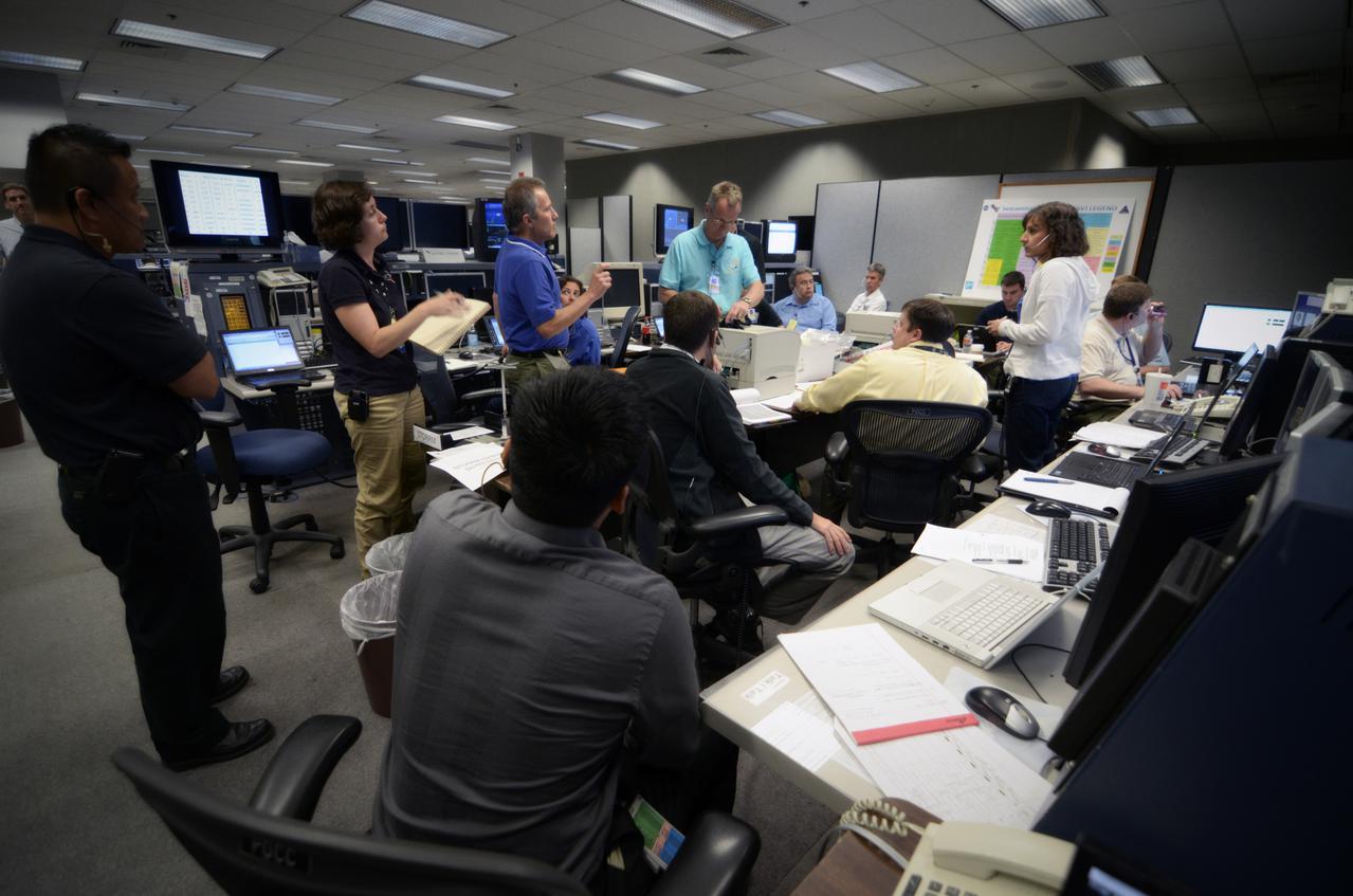 Teams conduct powerup and docking operations for the Sensor Test for Orion Relative Navigation Risk Mitigation (STORRM) in a payload support room at Johnson Space Center’s Mission Control Center in Houston on May 17, 2011. STORRM was successfully demonstrated on Space Shuttle Endeavour’s STS-134 mission to the International Space Station. The goal of STORRM was to validate a new relative navigation sensor based on advanced laser and detector technology that will make docking and undocking spacecraft easier and safer. It also tested the hardware in the same environment that the sensors would experience on the first Orion rendezvous to another vehicle.
