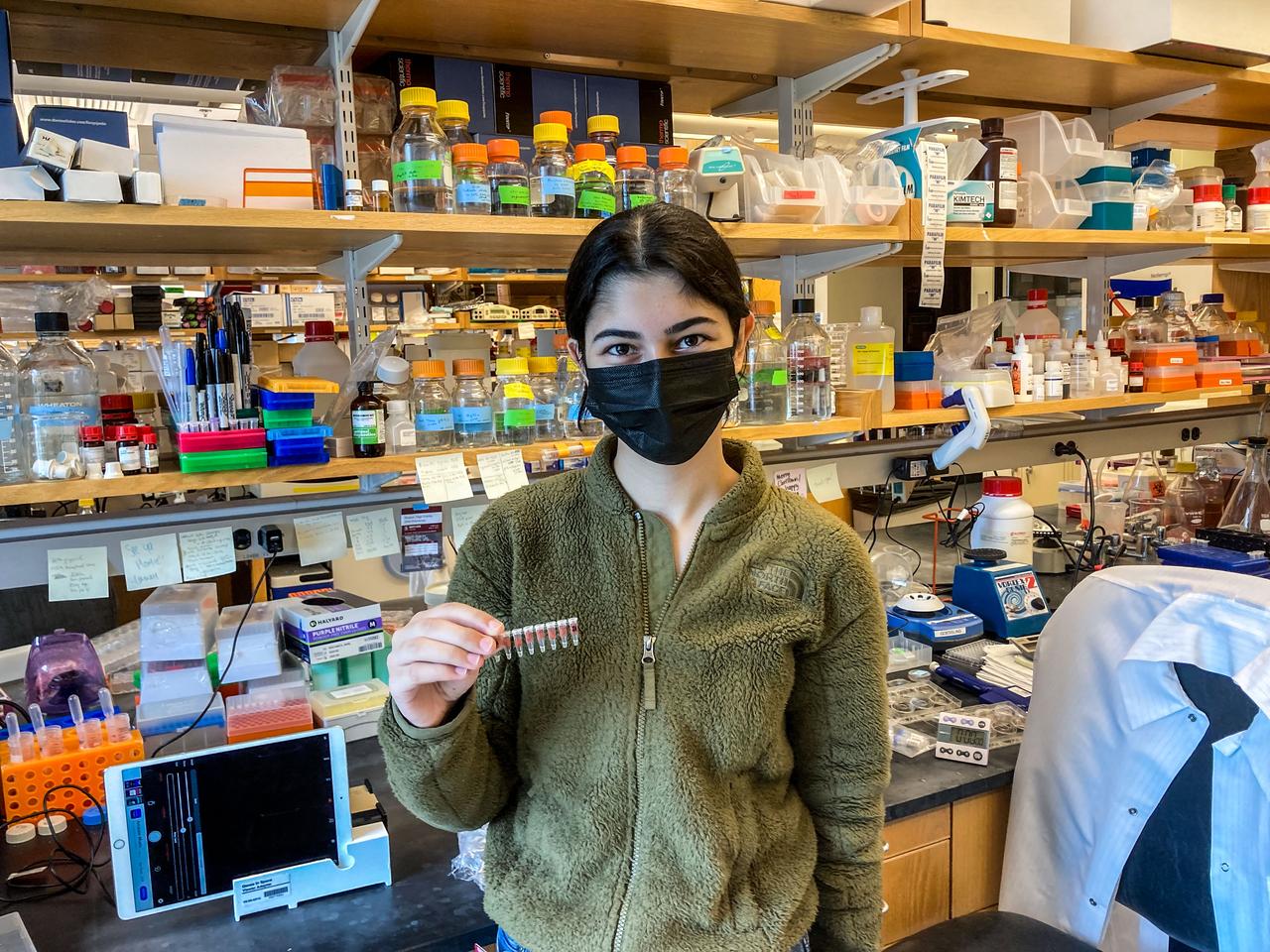 jsc2022e042476 (5/6/2022) --- Selin Kocalar, the student who designed the experiment on which Genes in Space-9 is based, prepares her samples for launch. Image courtesy of Genes in Space.