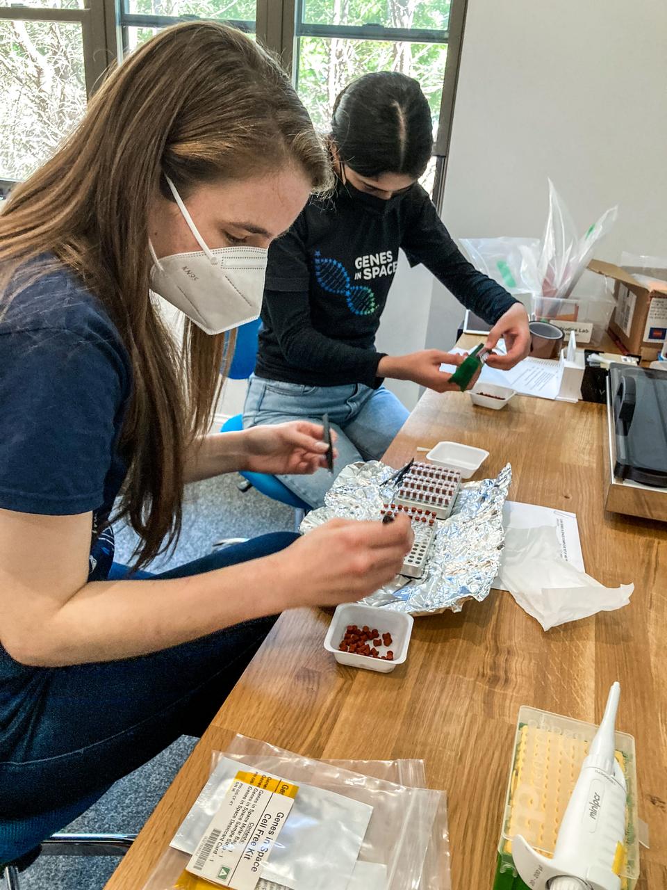 jsc2022e042477 (5/6/2022) --- Selin Kocalar, the student who designed the experiment on which Genes in Space-9 is based, readies her experimental samples for launch alongside her mentor, Bess Miller. Image courtesy of Genes in Space.