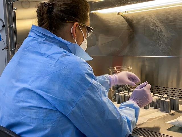jsc2022e042488 (4/20/2022) --- A closeup of Pacific Northwest National Laboratory (PNNL) staff technician Yuliya Farris preparing sterile spaces used to hold soil in place during Dynamics of the Microbiome in Space (DynaMoS). Image courtesy of the Pacific Northwest National Laboratory.