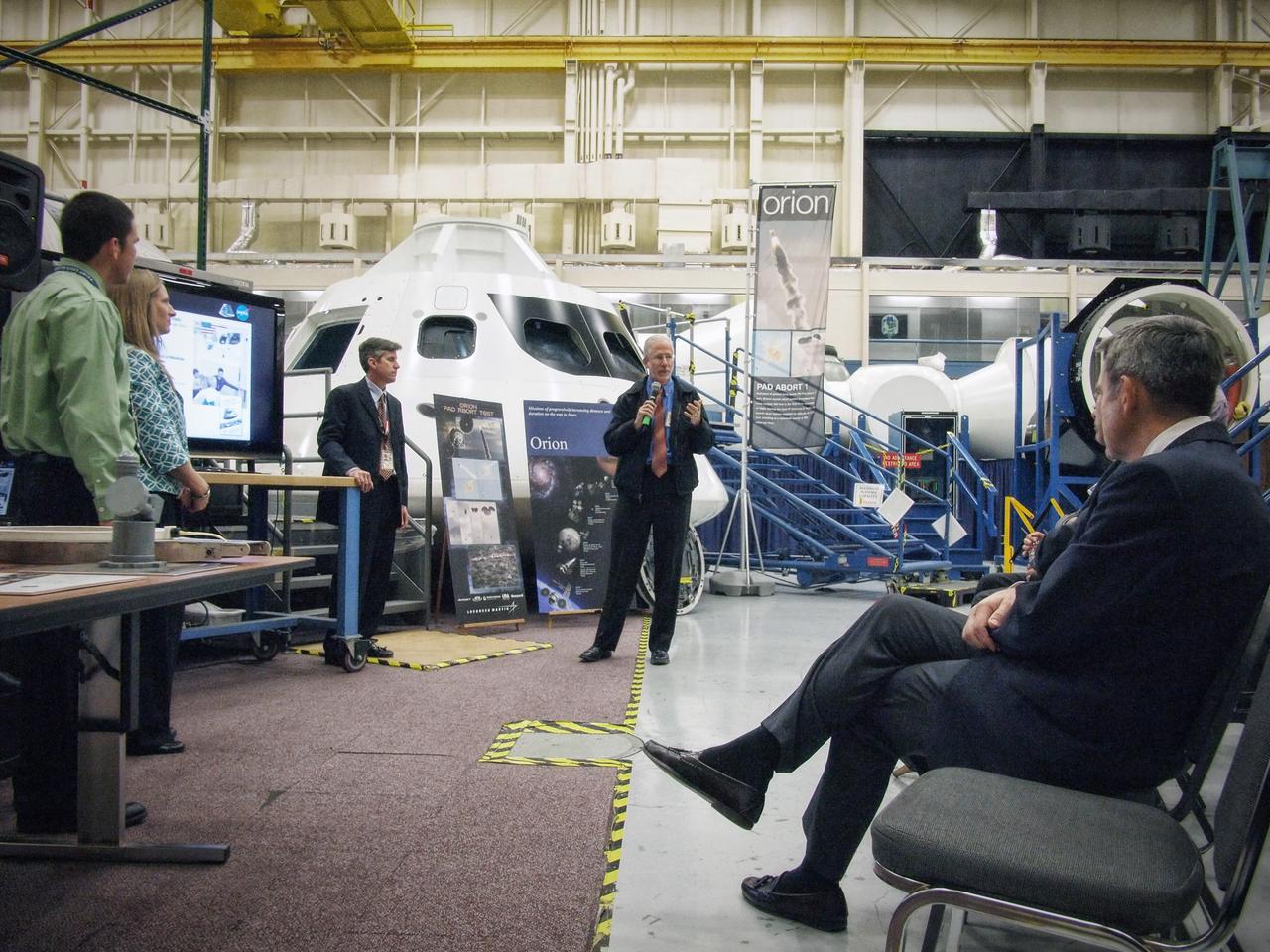Orion Program Manager Mark Geyer introduces Jeff Fox, Christie Sauers, and Phillip Reyes to NASA center directors in front of the Orion mockup in Building 9 at Johnson Space Center in Houston on Nov. 10, 2011. Part of Batch image transfer from Flickr.