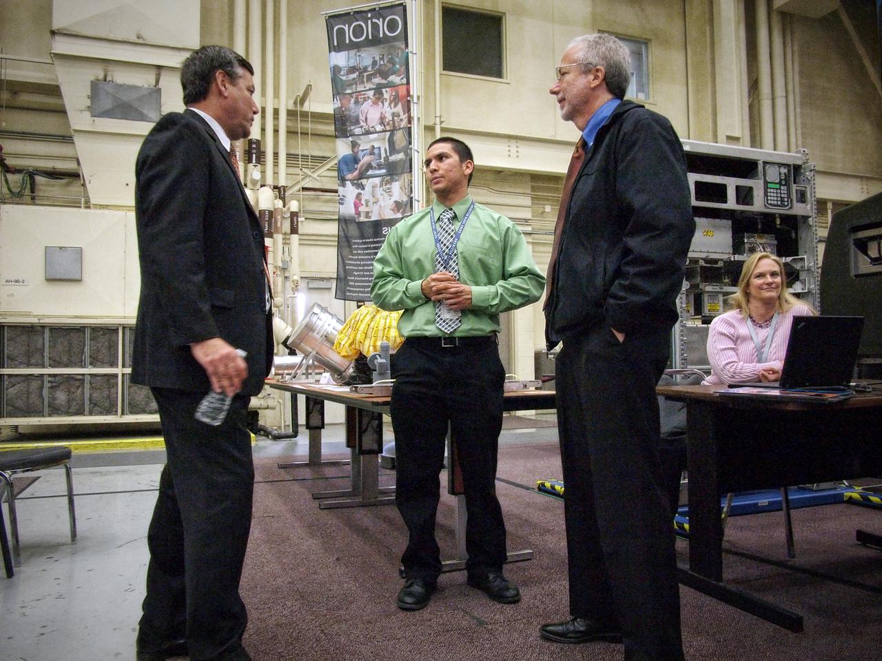 Stennis Space Center Director Patrick Scheuermann speaks with Philip Reyes and Orion Program Manager Mark Geyer in Building 9 at Johnson Space Center in Houston on Nov. 10, 2011. Part of Batch image transfer from Flickr.