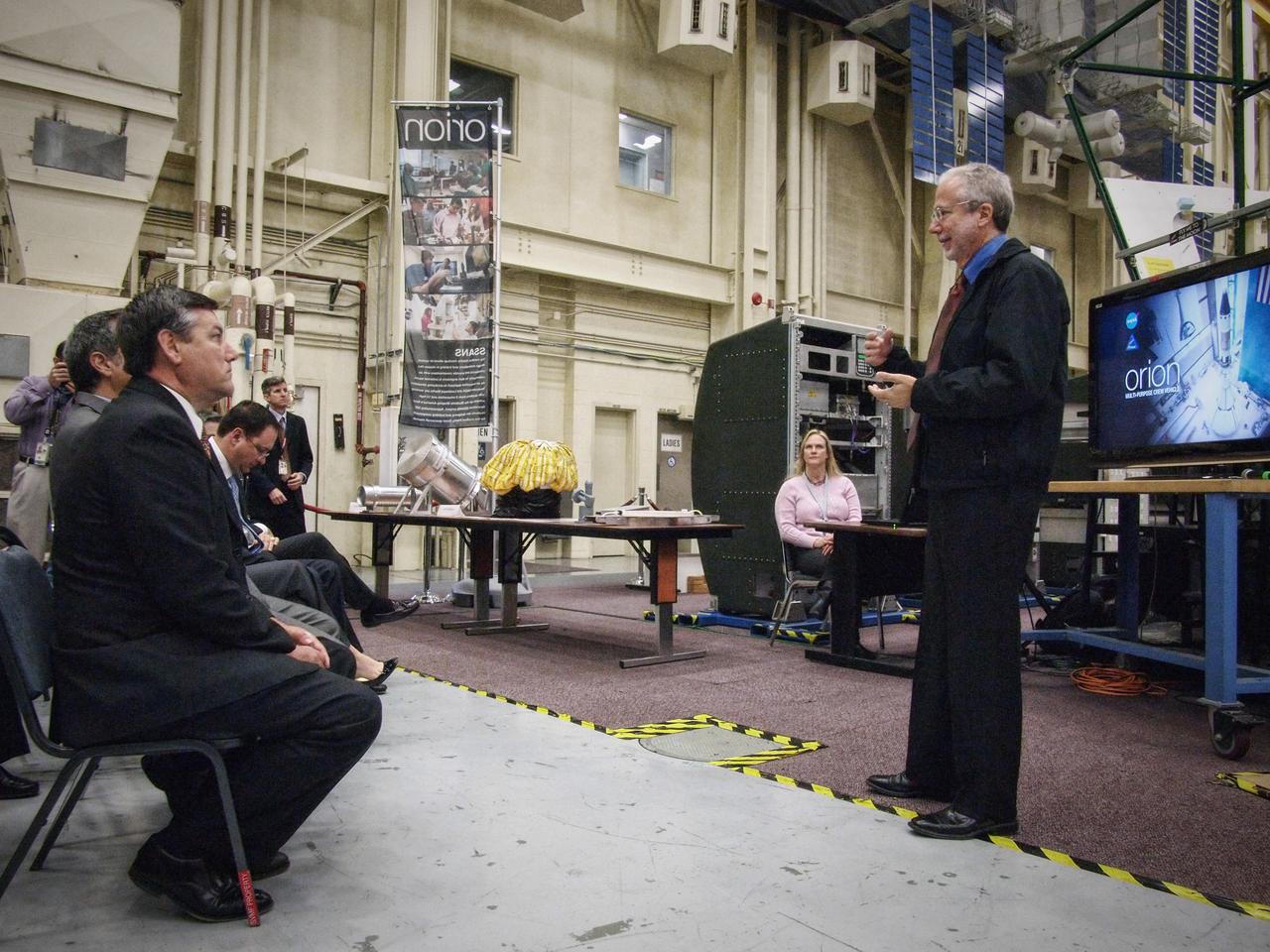 Orion Program Manager Mark Geyer speaks to NASA center directors in front of the Orion mockup in Building 9 at Johnson Space Center in Houston on Nov. 10, 2011. Part of Batch image transfer from Flickr.