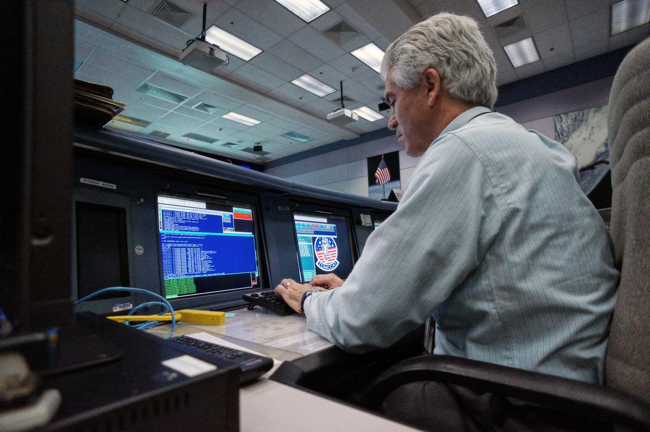 Orion teams complete a connectivity test in preparation for Exploration Flight Test-1 (EFT-1) in the Mission Control Center at Johnson Space Center in Houston on Jan. 30, 2011. Part of Batch image transfer from Flickr.