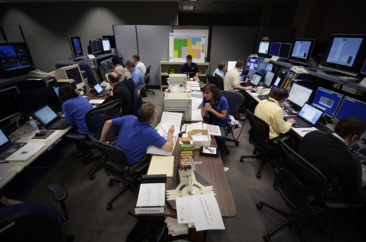 Teams conduct powerup and docking operations for the Sensor Test for Orion Relative Navigation Risk Mitigation (STORRM) in a payload support room at Johnson Space Center’s Mission Control Center in Houston on May 18, 2011. STORMM was successfully demonstrated on Space Shuttle Endeavour’s STS-134 mission to the International Space Station..The goal of STORRM was to validate a new relative navigation sensor based on advanced laser and detector technology that will make docking and undocking spacecraft easier and safer. It also tested the hardware in the same environment that the sensors would experience on the first Orion rendezvous to another vehicle. Part of Batch image transfer from Flickr.