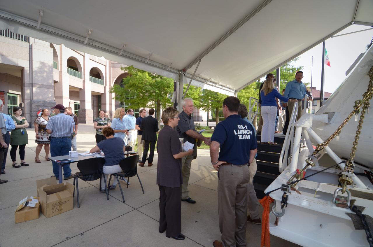 Visitors prepare to view the Orion crew module flown on NASA’s Pad Abort-1 (PA-1) flight test, which is on display at an event at the Bullock Texas State History Museum in Austin, Texas on June 20, 2011. Part of Batch image transfer from Flickr.