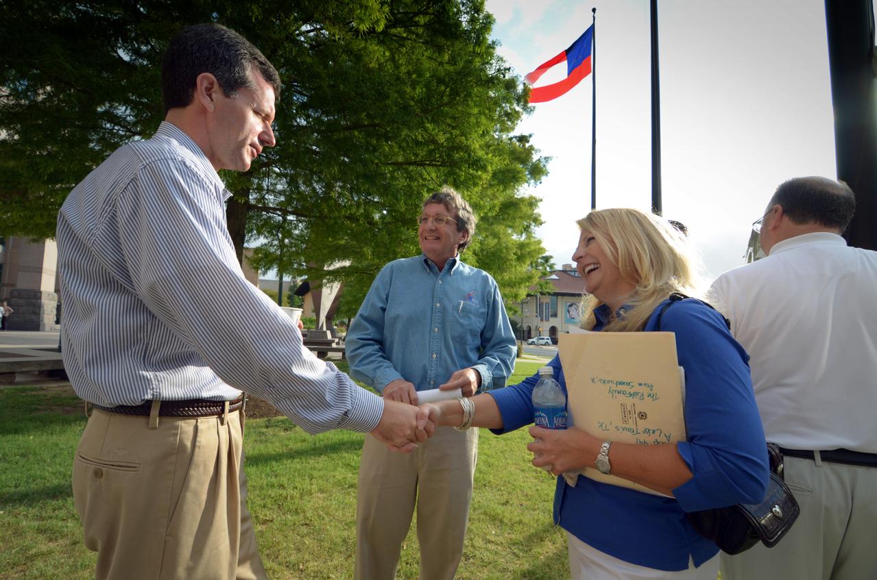Visitors prepare to view the Orion crew module flown on NASA’s Pad Abort-1 (PA-1) flight test, which is on display at an event at the Bullock Texas State History Museum in Austin, Texas on June 20, 2011.  Part of Batch image transfer from Flickr.