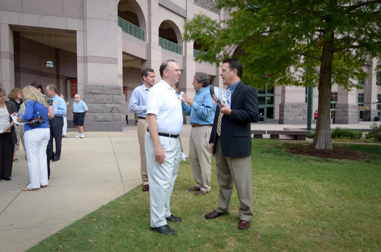 Visitors prepare to view the Orion crew module flown on NASA’s Pad Abort-1 (PA-1) flight test, which is on display at an event at the Bullock Texas State History Museum in Austin, Texas on June 20, 2011. Part of Batch image transfer from Flickr.