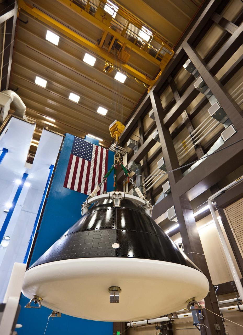 The Orion crew module test article is lifted from the transport fixture to the test stand in the Reverberant Acoustics Laboratory (RAL) at the Lockheed Martin facility in Waterton, Colorado for acoustic testing on June 28, 2011. The testing of approximately 150dB simulated sound pressure levels that the vehicle will encounter during launch, ascent, and if required, abort. Part of Batch image transfer from Flickr.