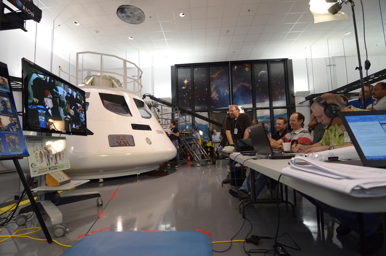 Engineers evaluate early space suit designs in an Orion mockup at Lockheed Martin’s Exploration Development Lab (EDL) in Houston on July 1, 2011. Part of Batch image transfer from Flickr.