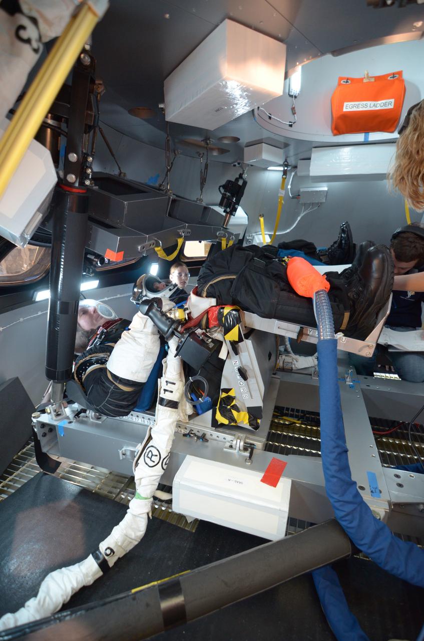 Engineers evaluate early space suit designs in an Orion mockup at Lockheed Martin’s Exploration Development Lab (EDL) in Houston on July 1, 2011.  Part of Batch image transfer from Flickr.