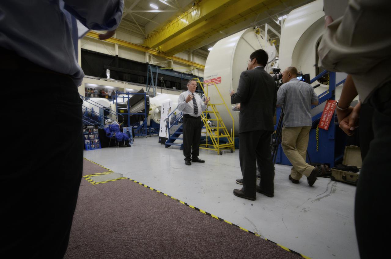 Members of the media attend a Media Day event and visit the Orion mockup in the Space Vehicle Mockup Facility in Building 9 of the Johnson Space Center in Houston on July 1, 2011. Part of Batch image transfer from Flickr.