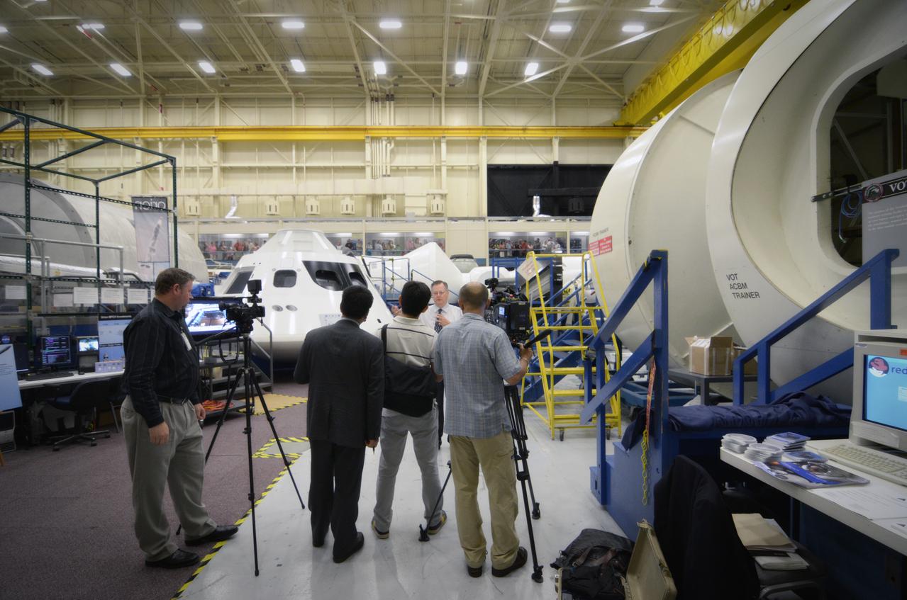 Members of the media attend a Media Day event and visit the Orion mockup in the Space Vehicle Mockup Facility in Building 9 of the Johnson Space Center in Houston on July 1, 2011. Part of Batch image transfer from Flickr.