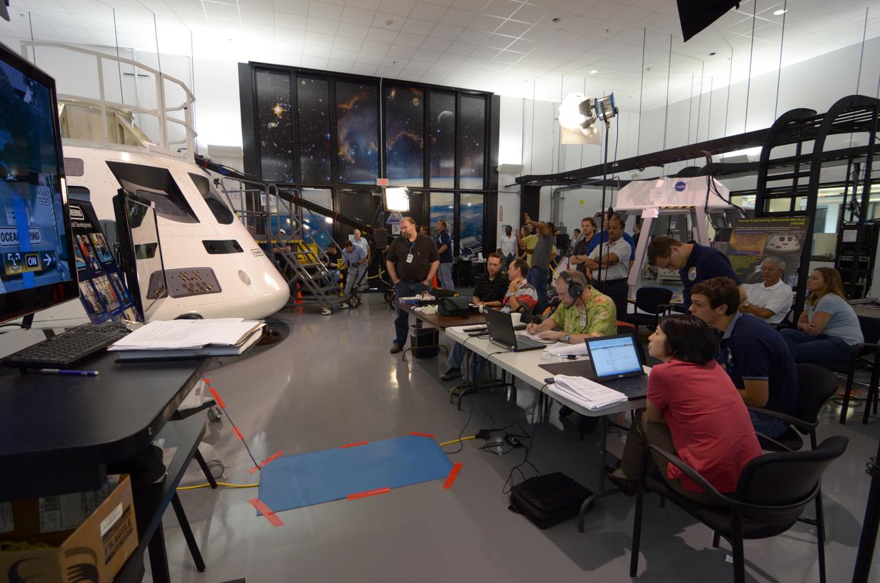 Engineers evaluate early space suit designs in an Orion mockup at Lockheed Martin’s Exploration Development Lab (EDL) in Houston on July 1, 2011.  Part of Batch image transfer from Flickr.