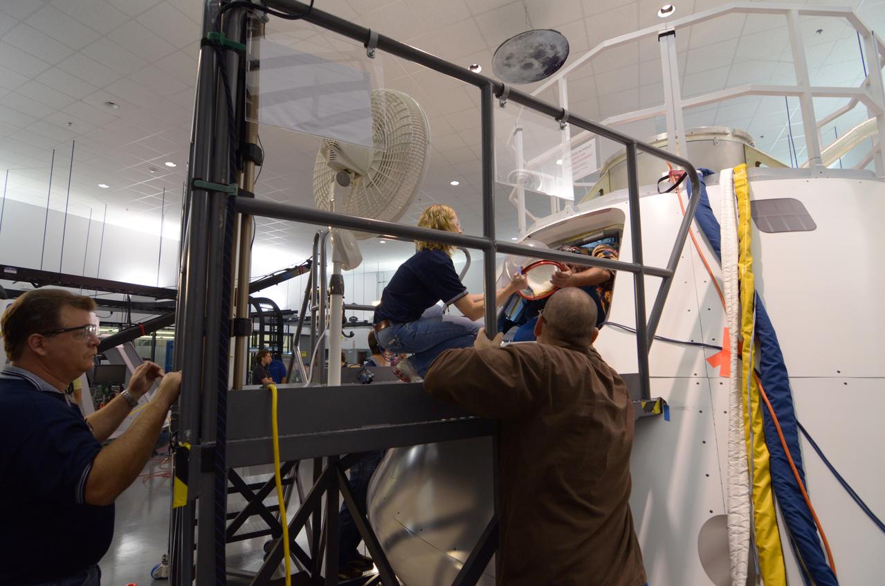 Engineers evaluate early space suit designs in an Orion mockup at Lockheed Martin’s Exploration Development Lab (EDL) in Houston on July 1, 2011.  Part of Batch image transfer from Flickr.