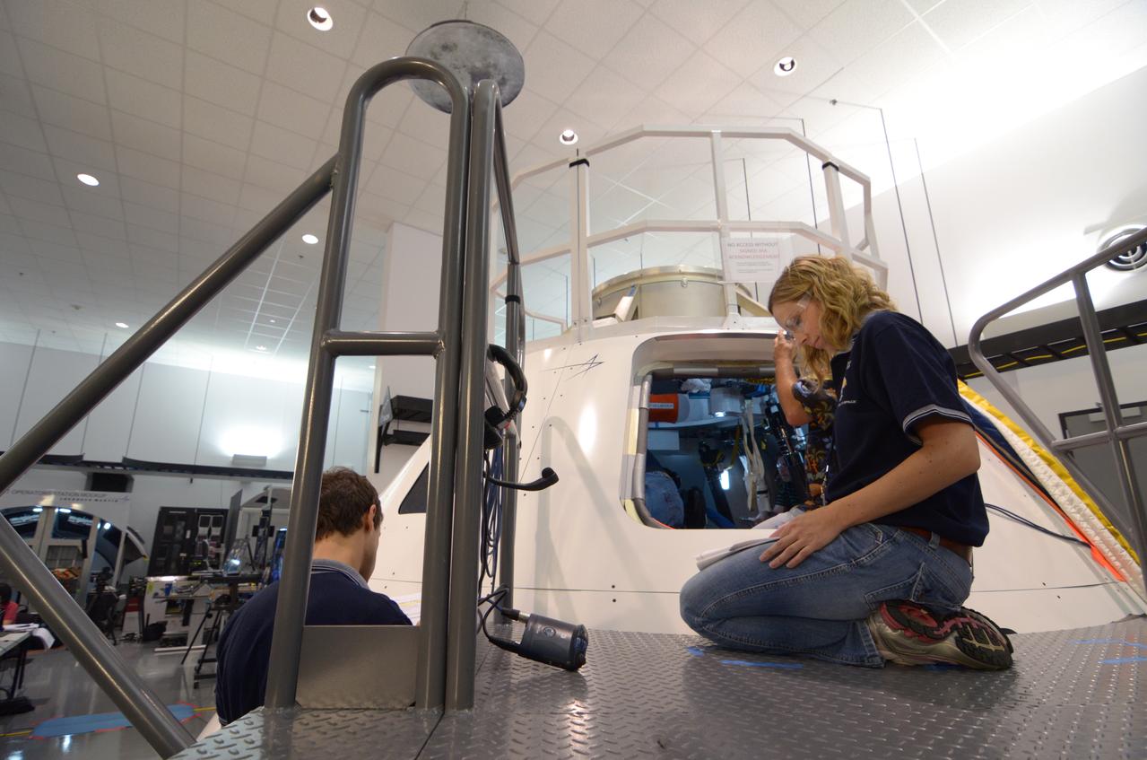 Engineers evaluate early space suit designs in an Orion mockup at Lockheed Martin’s Exploration Development Lab (EDL) in Houston on July 1, 2011.  Part of Batch image transfer from Flickr.