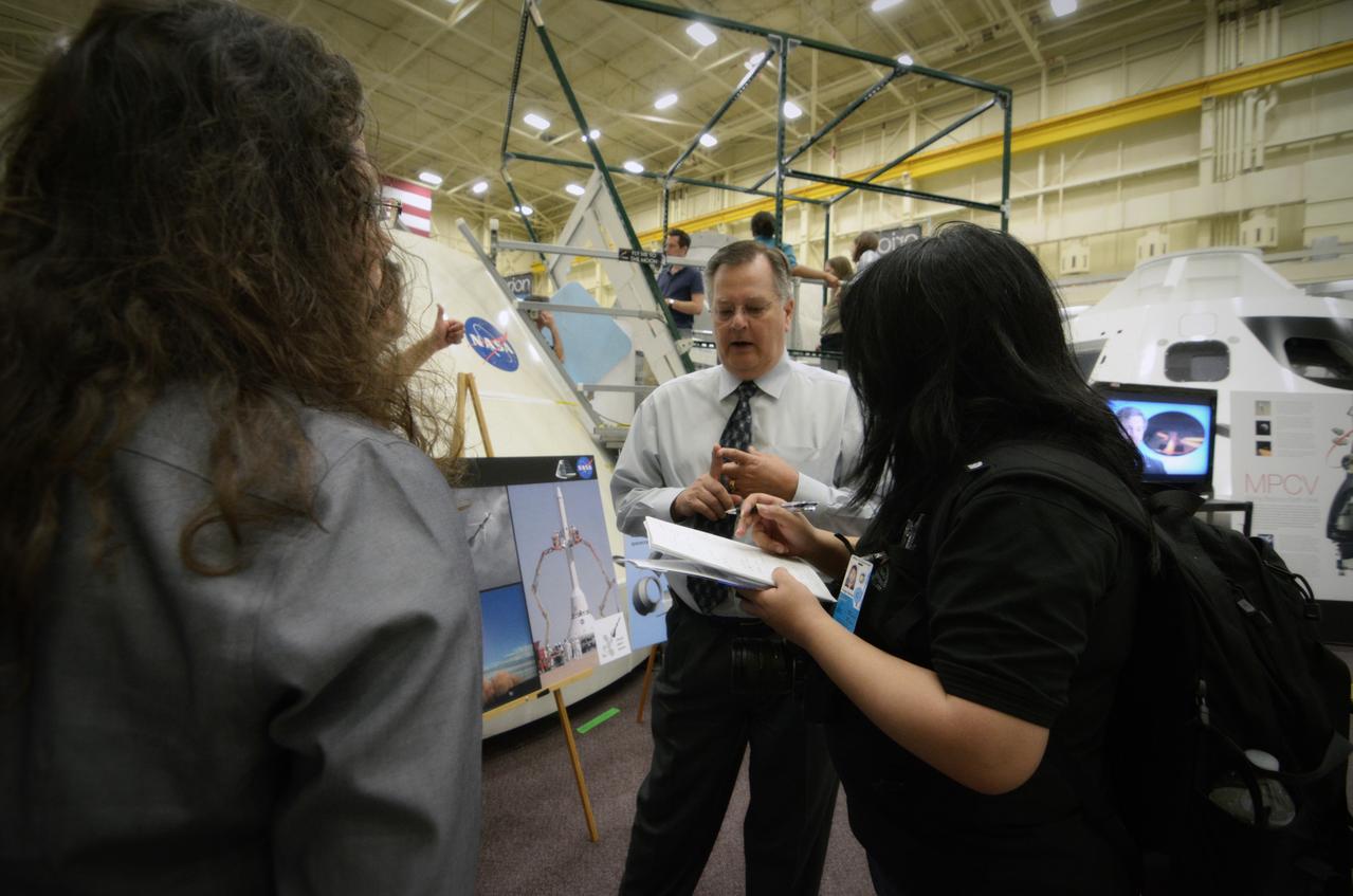 Members of the media attend a Media Day event and visit the Orion mockup in the Space Vehicle Mockup Facility in Building 9 of the Johnson Space Center in Houston on July 1, 2011. Part of Batch image transfer from Flickr.