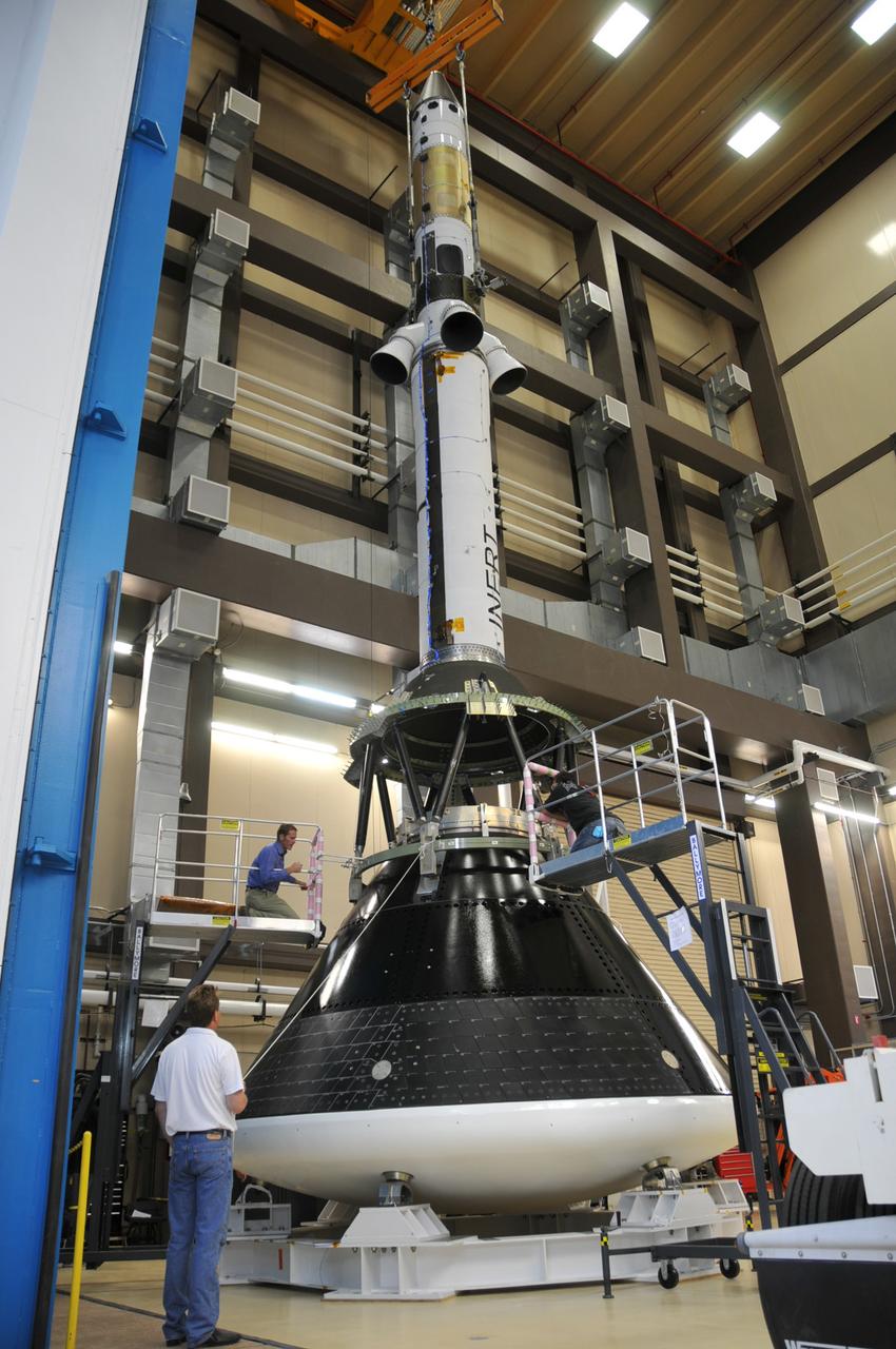 The Orion launch abort system and crew module test articles undergo stacking at Lockheed Martin’s facilities near Denver in preparation for acoustic testing on Aug. 9, 2011. To emulate the sound pressure levels experienced at launch, the tests exposed Orion and its launch abort system to acoustic levels exceeding 150 decibels, while hundreds of instruments record the vehicle’s response. Part of Batch image transfer from Flickr.