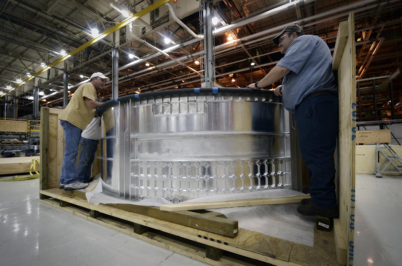 Elements for the Exploration Flight Test-1 (EFT-1) Orion pressure vessel are prepared for welding at NASA’s Michoud Assembly Facility in New Orleans on Sept. 7, 2011. Orion’s pressure vessel is underlying frame of the crew module that will provide an air-tight, habitable space for astronauts on future missions to the Moon. Part of Batch image transfer from Flickr.