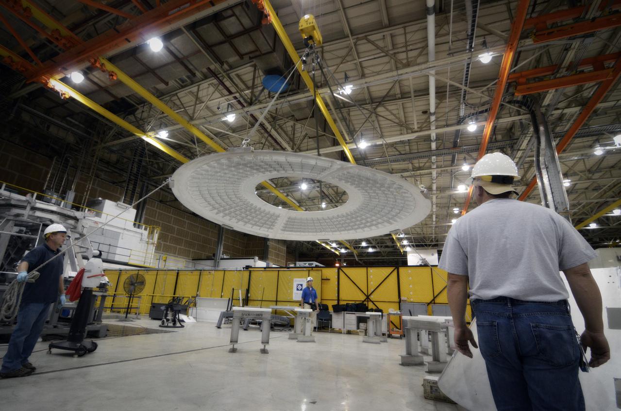 Elements for the Exploration Flight Test-1 (EFT-1) Orion pressure vessel are prepared for welding at NASA’s Michoud Assembly Facility in New Orleans on Sept. 7, 2011. Orion’s pressure vessel is underlying frame of the crew module that will provide an air-tight, habitable space for astronauts on future missions to the Moon. Part of Batch image transfer from Flickr.