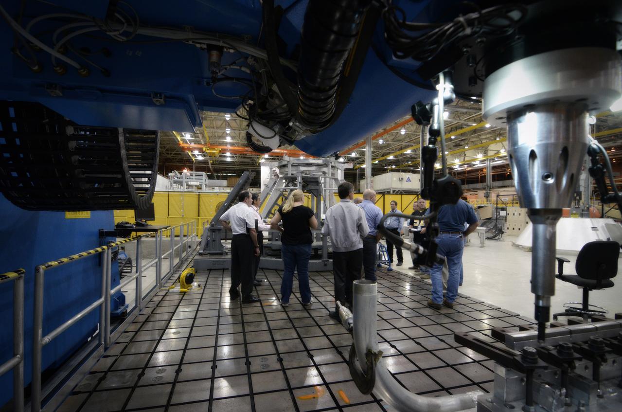 Technicians begin welding the Exploration Flight Test-1 (EFT-1) Orion pressure vessel at NASA’s Michoud Assembly Facility in New Orleans on Sept. 9, 2011. Orion’s pressure vessel is underlying frame of the crew module that will provide an air-tight, habitable space for astronauts on future missions to the Moon. Part of Batch image transfer from Flickr.