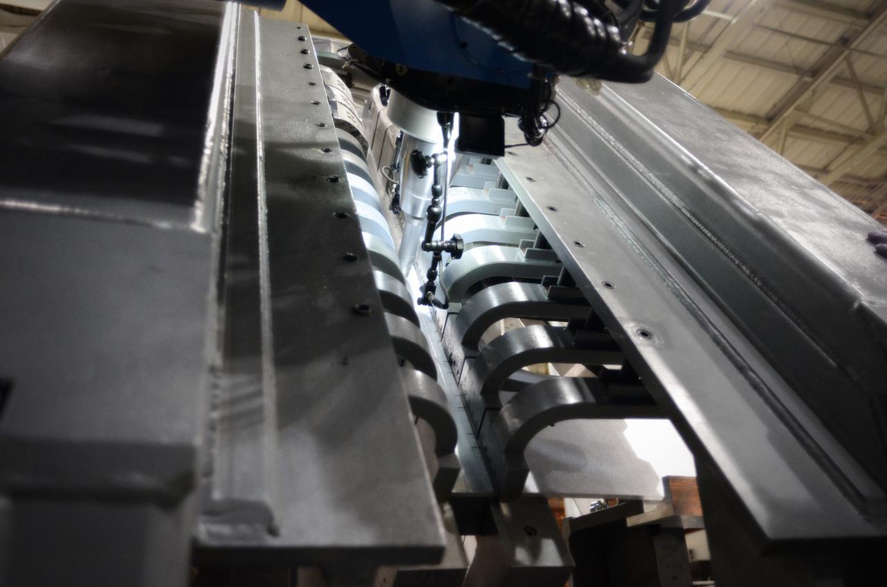 Technicians begin welding the Exploration Flight Test-1 (EFT-1) Orion pressure vessel at NASA’s Michoud Assembly Facility in New Orleans on Sept. 9, 2011. Orion’s pressure vessel is underlying frame of the crew module that will provide an air-tight, habitable space for astronauts on future missions to the Moon. Part of Batch image transfer from Flickr.
