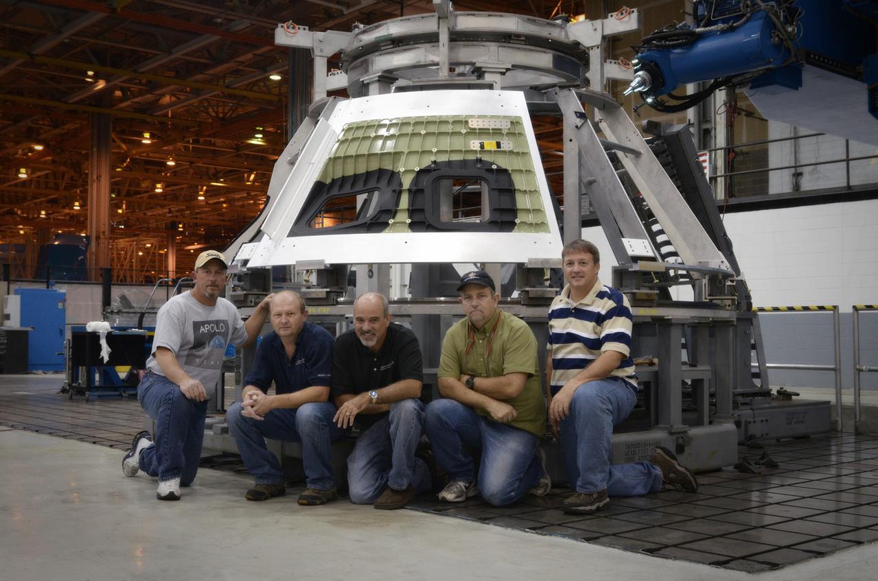 Technicians begin welding the Exploration Flight Test-1 (EFT-1) Orion pressure vessel at NASA’s Michoud Assembly Facility in New Orleans on Sept. 9, 2011. Orion’s pressure vessel is underlying frame of the crew module that will provide an air-tight, habitable space for astronauts on future missions to the Moon. Part of Batch image transfer from Flickr.