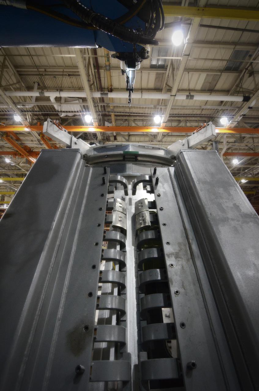 Technicians begin welding the Exploration Flight Test-1 (EFT-1) Orion pressure vessel at NASA’s Michoud Assembly Facility in New Orleans on Sept. 9, 2011. Orion’s pressure vessel is underlying frame of the crew module that will provide an air-tight, habitable space for astronauts on future missions to the Moon. Part of Batch image transfer from Flickr.
